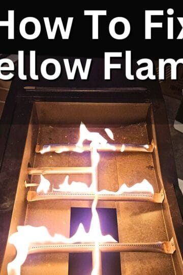 burners for a griddle showing yellow flames. Now griddle top on