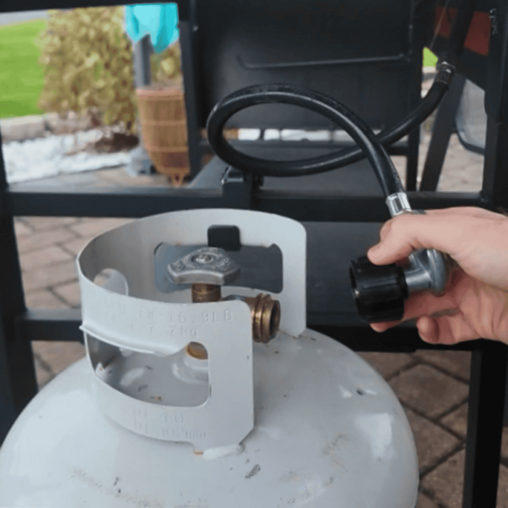 removing a hose from a propane tank