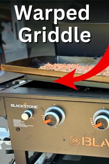 a warped blackstone griddle with a red arrow.